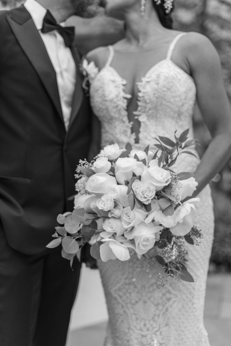 black and white bride and groom portrait with florals