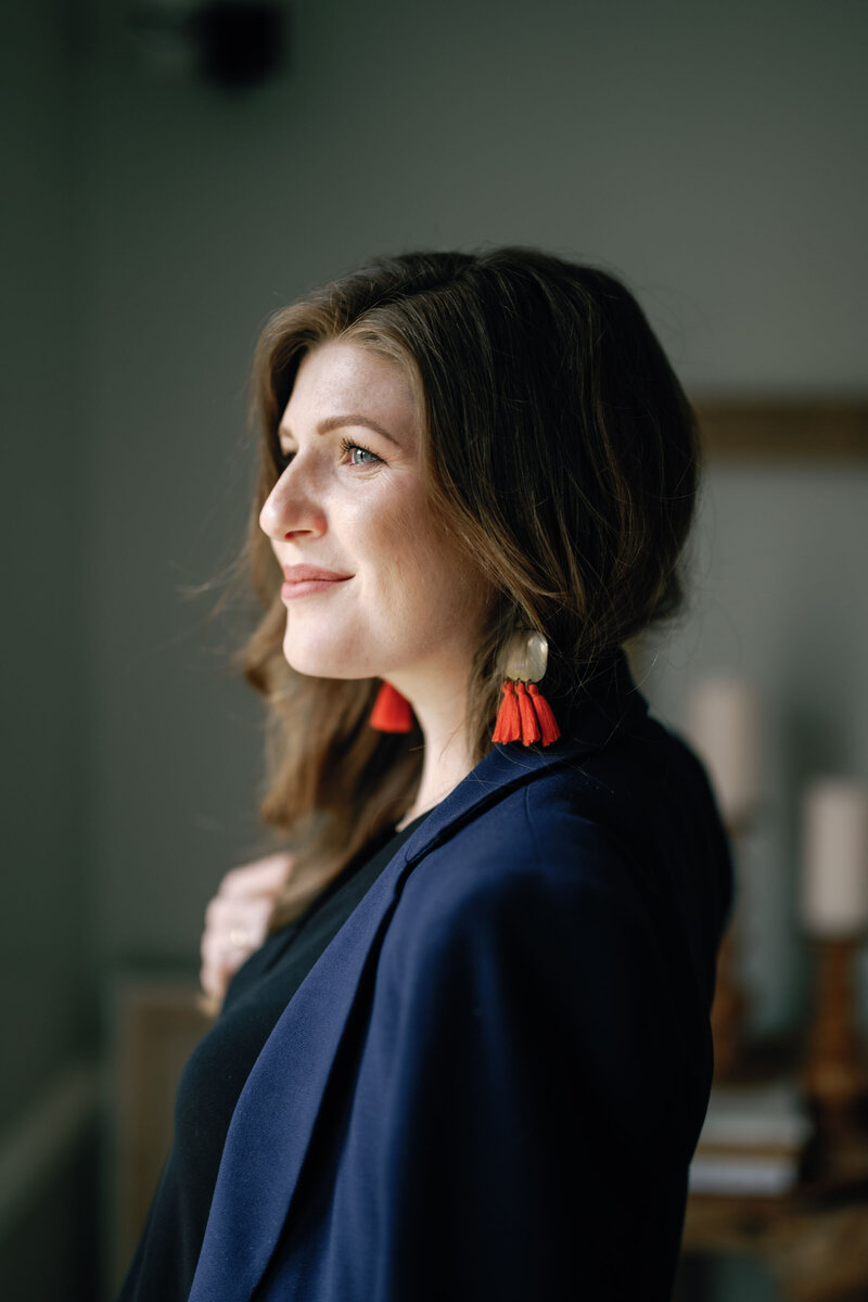 Stephanie Gaffney wearing black blazer and fringe earrings