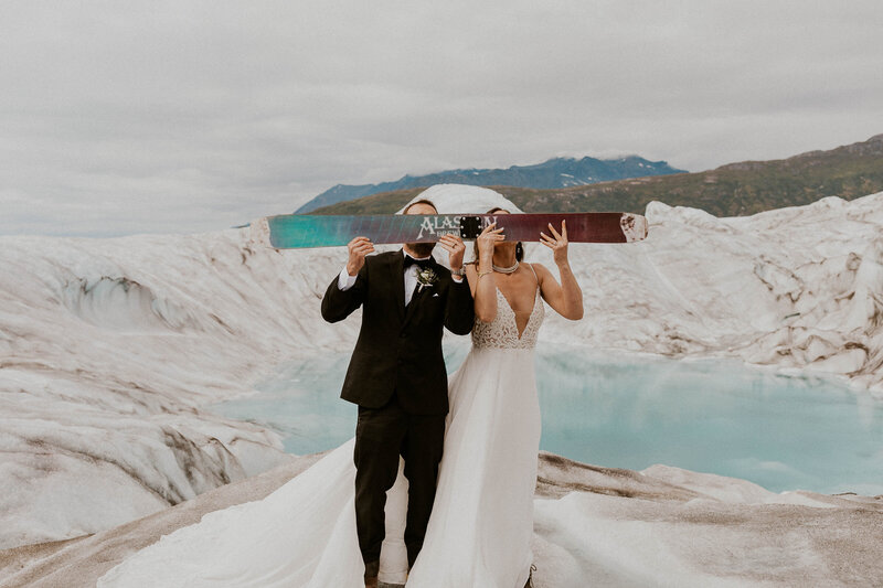 bride and groom on glacier
