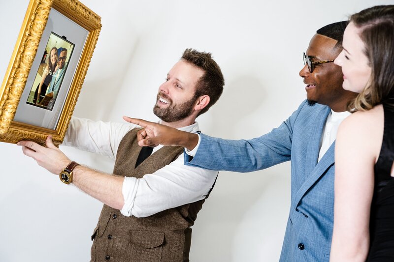 wedding guests posing for Roaming Frame photo booth