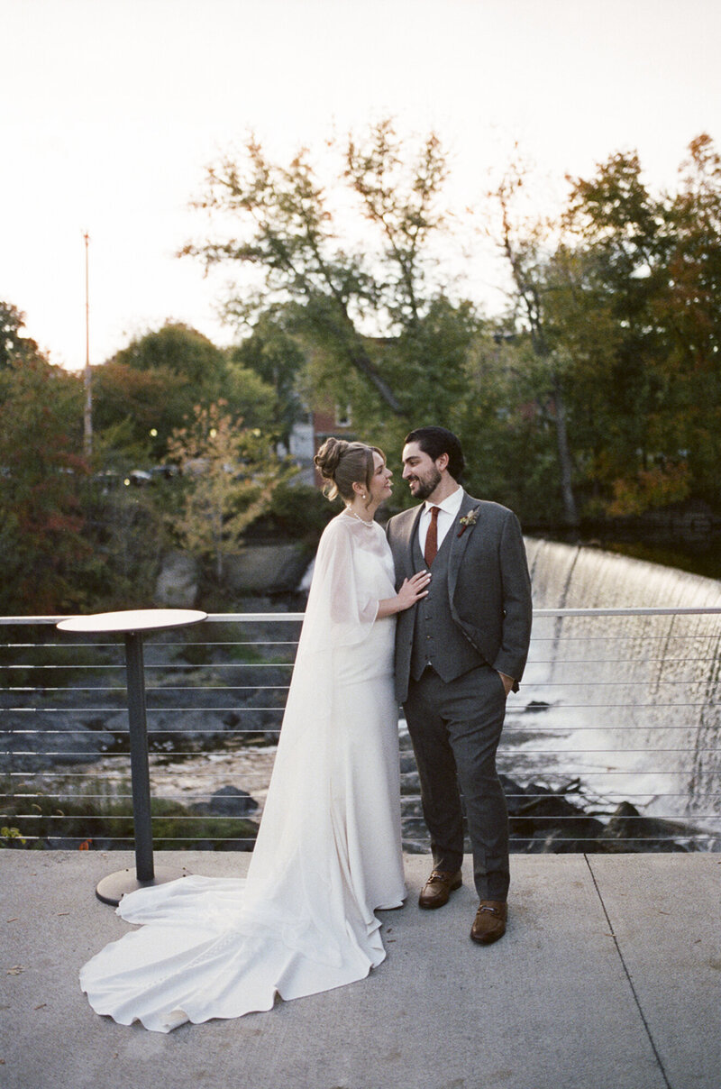 35mm film wedding portrait of bride and groom beside the waterfall at The Roundhouse in Beacon NY