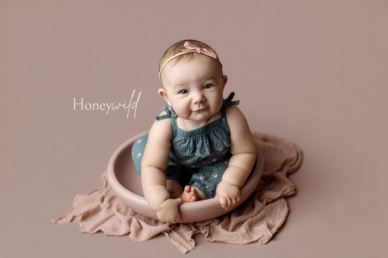 baby sitting on a monochromatic setup in grand rapids michigan