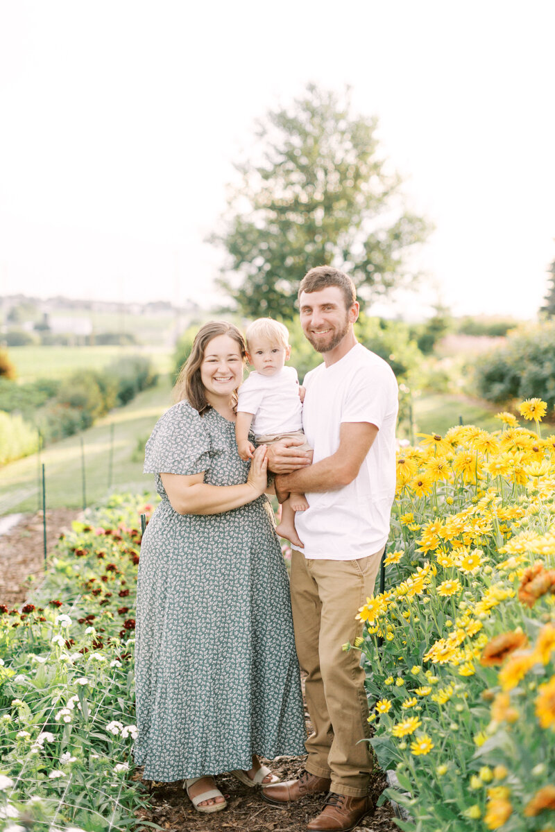 Family portrait together in a flower garden