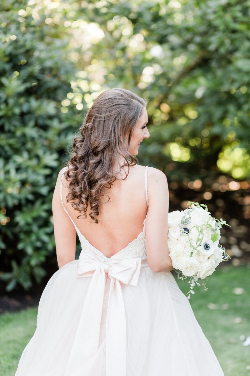 Blush pink wedding gown with bow