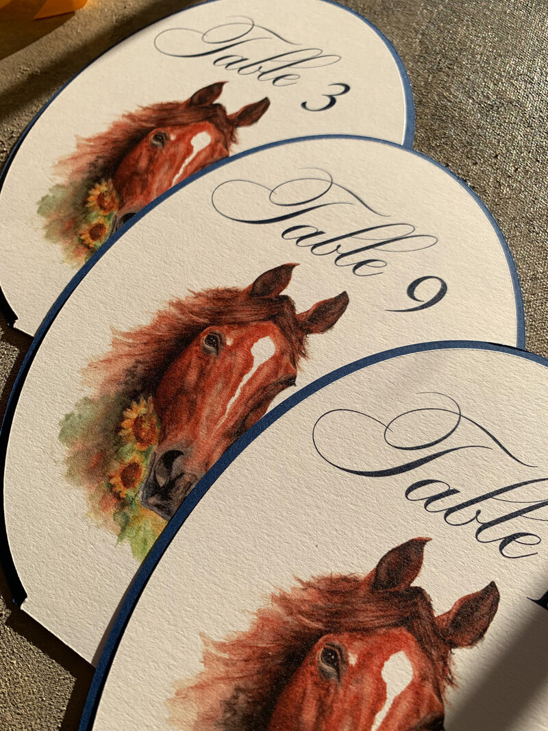 Table number calligraphy with horse drawing