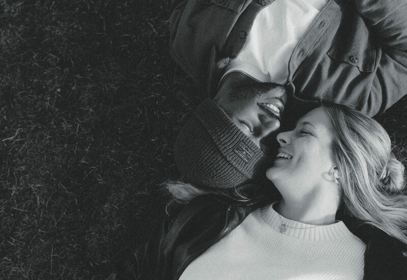 couple laying on the ground