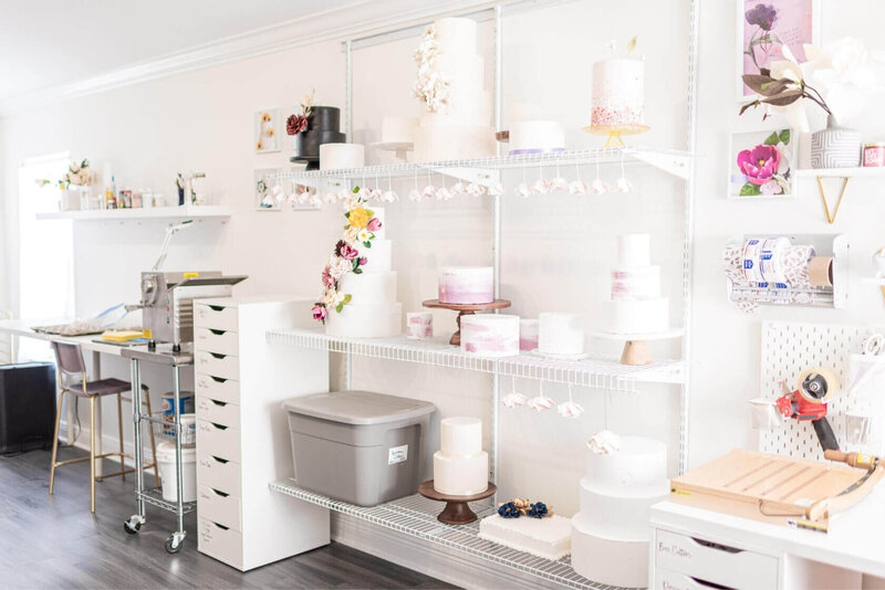 sugar flower studio shelf with display cakes and flowers