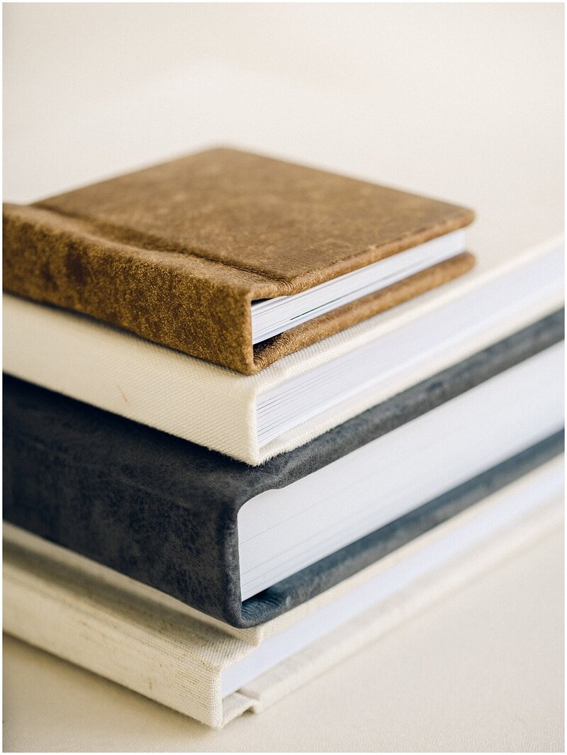 Picture of four stacked wedding albums