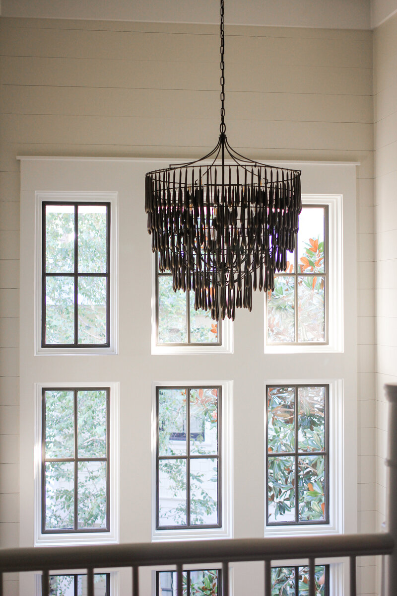 dark-teardrop-chandelier-stair-abundant-light