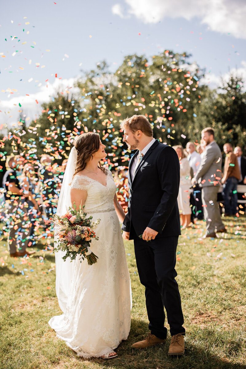 Confetti around bride and groom