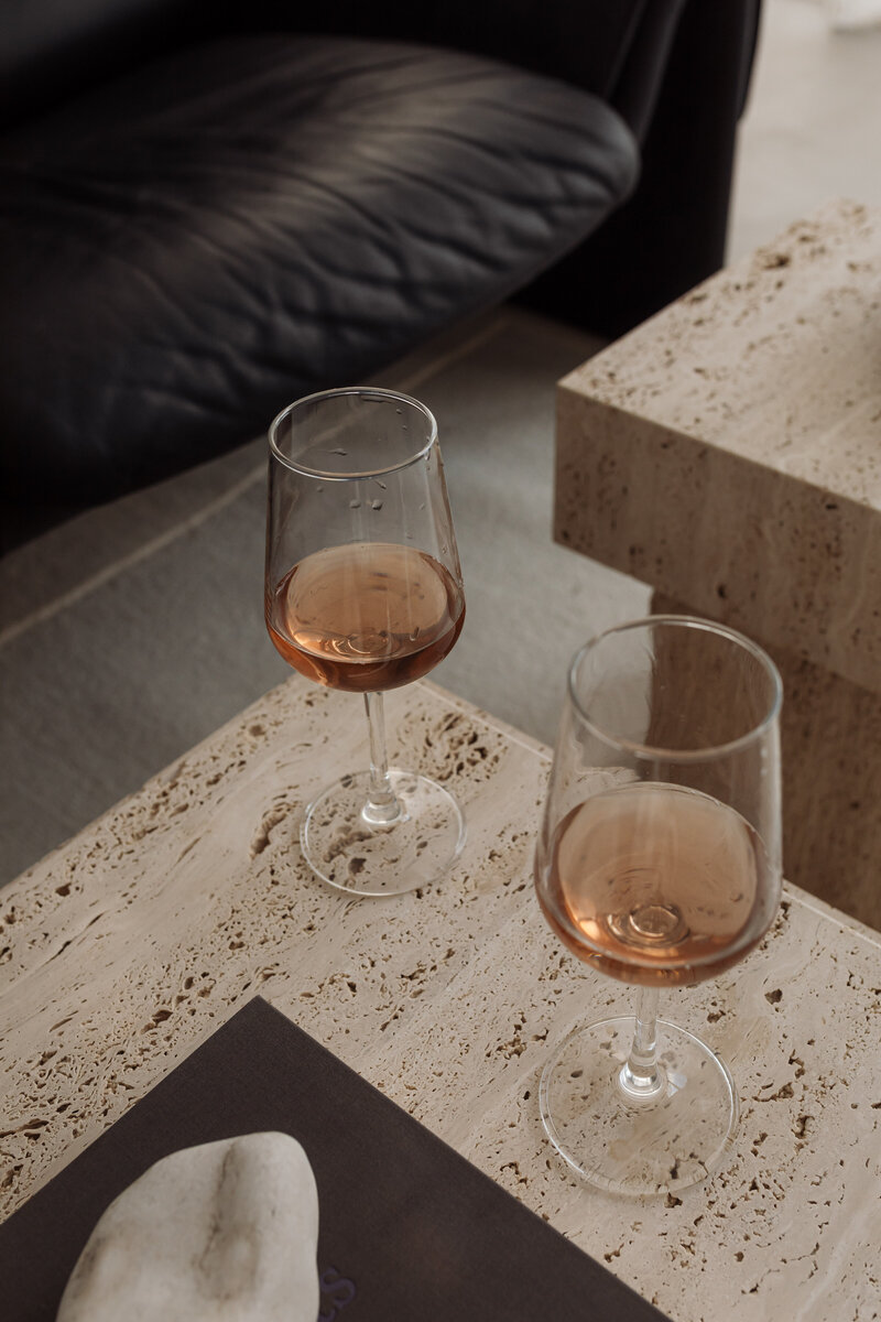 Two glasses of rosé on travertine