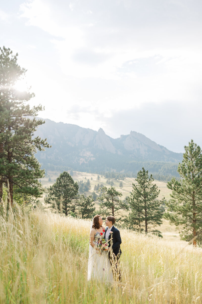 Boulder, Colorado LGBT+ elopement of two brides on a mountain photographed by Claire Katan Creative.