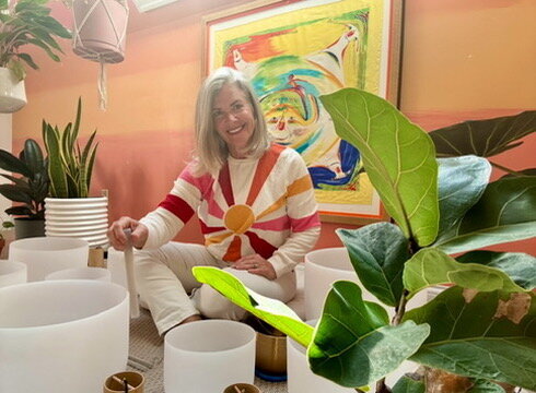 Cosmos Charm playing the sound bowls during Radiant Rhythm Reset retreat in Bardstown, KY