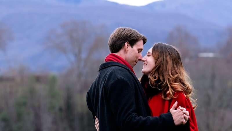 A couple standing close together about to kiss 