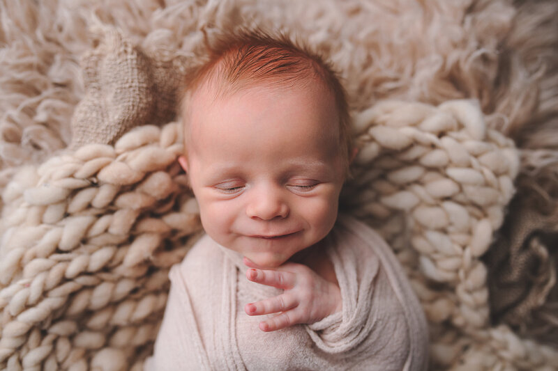 number one thing to do while pregnant is book your newborn session with a professional newborn photographer Munchkin Moments by Stephanie