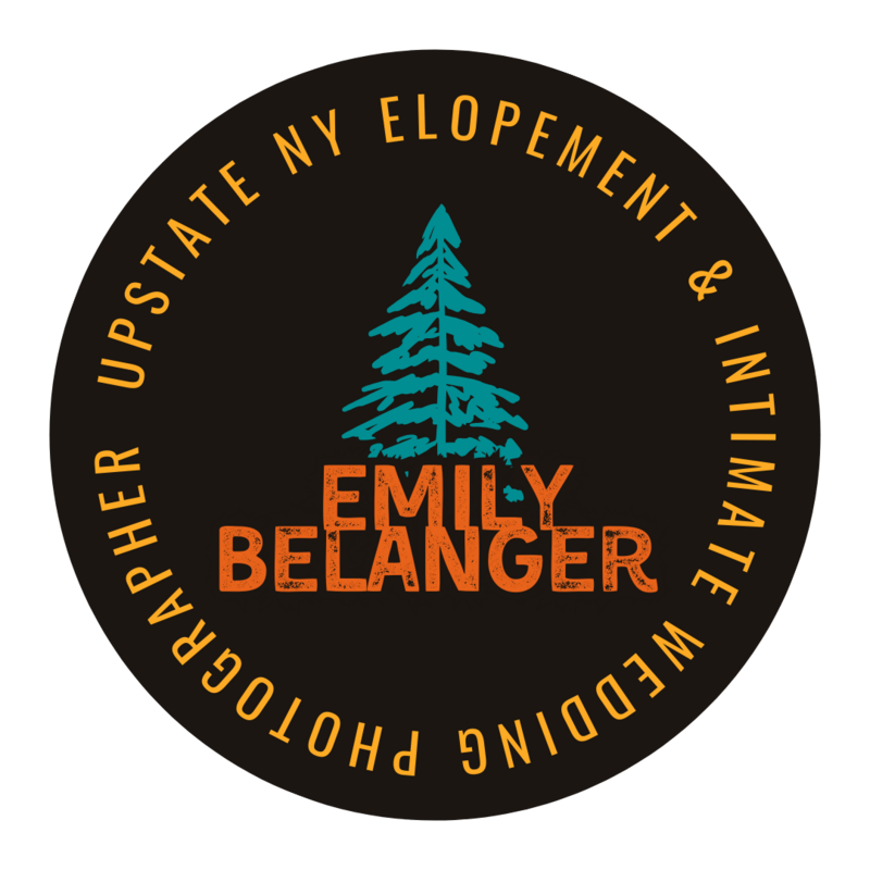 Brown badge with blue tree on it that says Emily Belanger Upstate NY Elopement and intimate wedding photographer