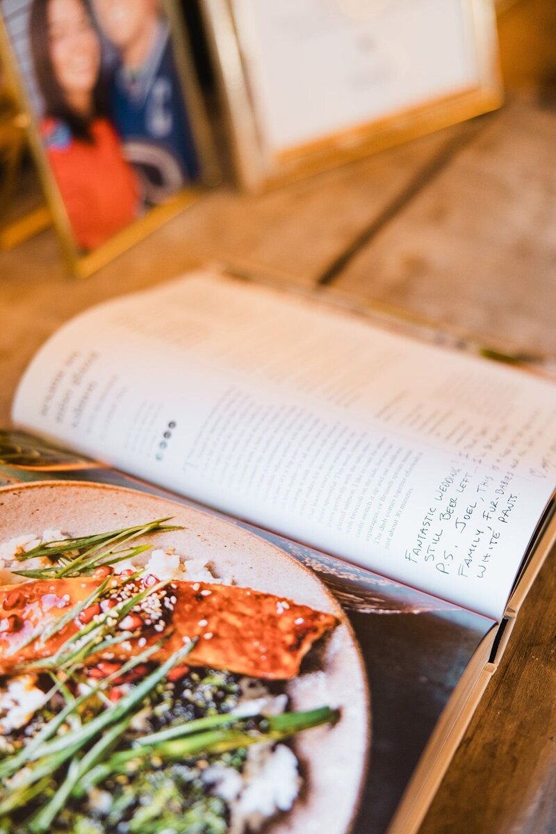 Cookbook being used as a guest book for a wedding