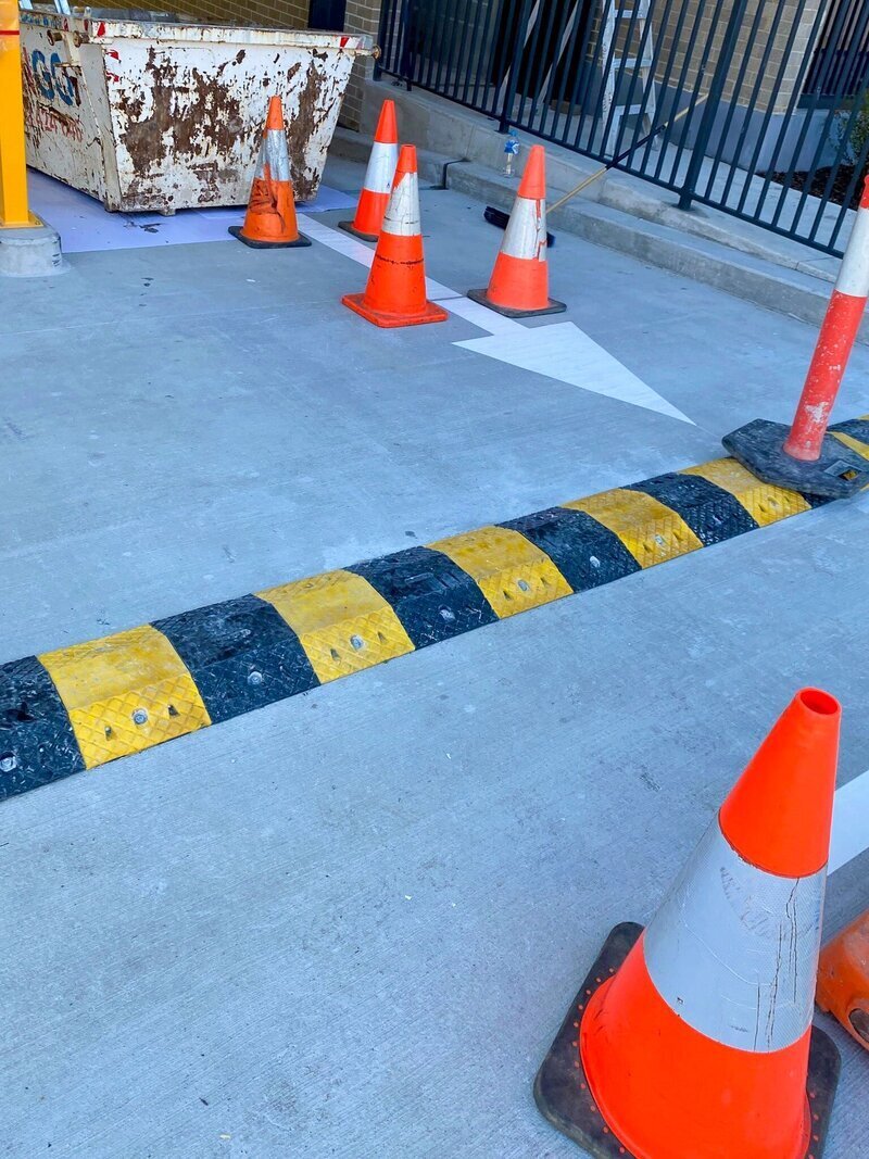 Rapid Epoxy & Linemarking worker in uniform prepping equipment to commence line marking