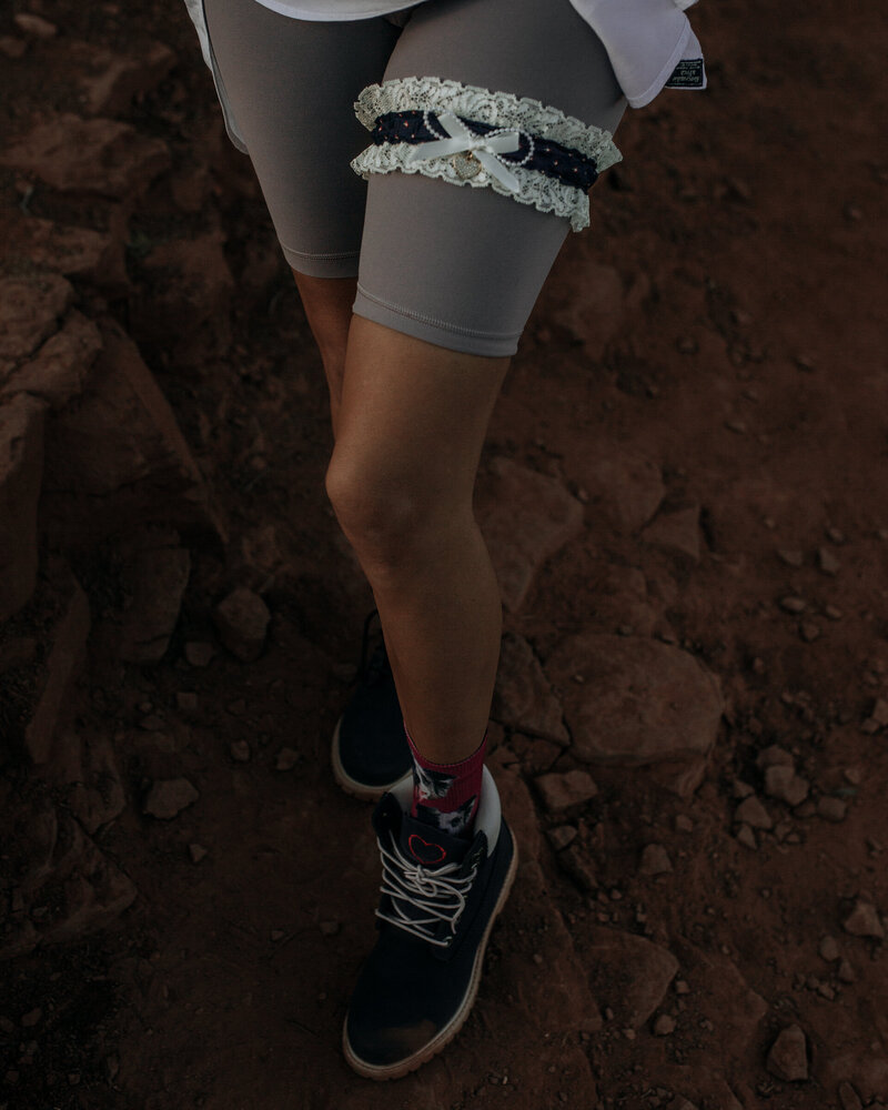 bride wears her garter while hiking in sedona