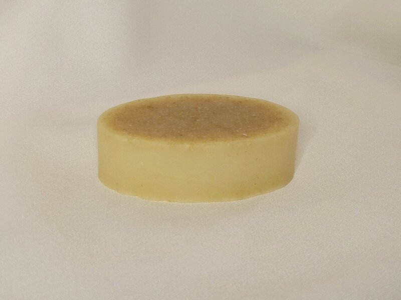 Single bar of Vanilla Oatmeal Honey soap handmade into an oval shape
