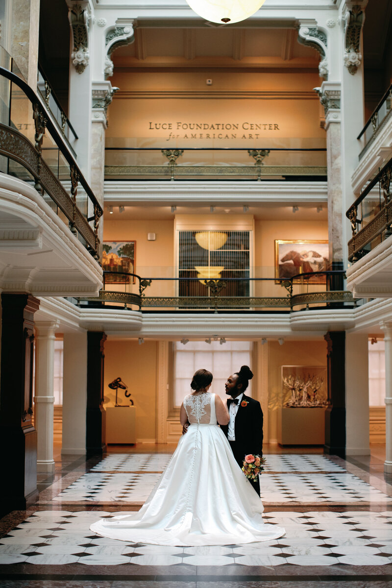 Bride and groom sharing a tender moment at the National Gallery of art in Washington DC