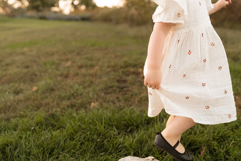 girl holding dress