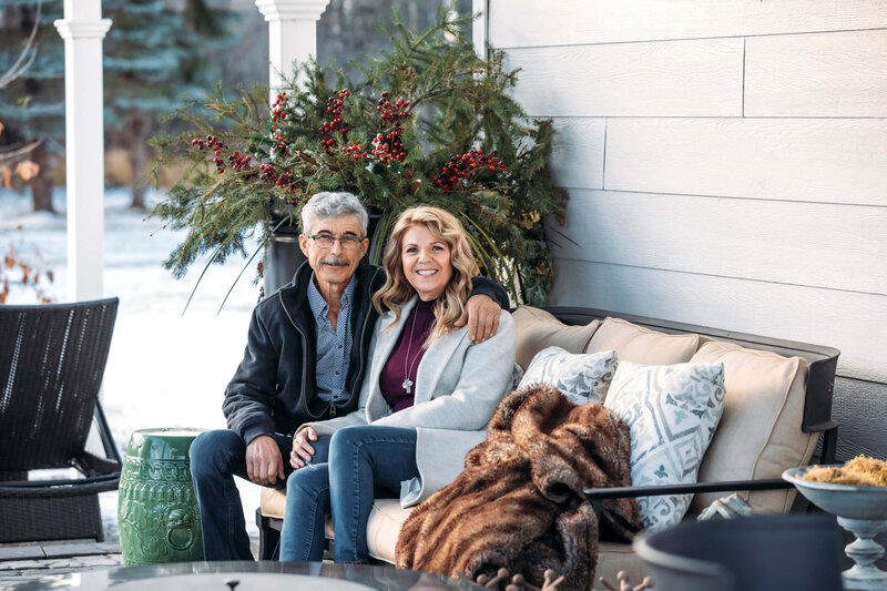 couple sitting on cozy sofa outdoors in winter