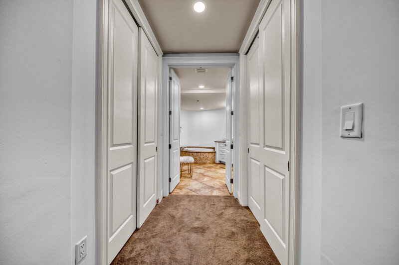 hallway with white doors