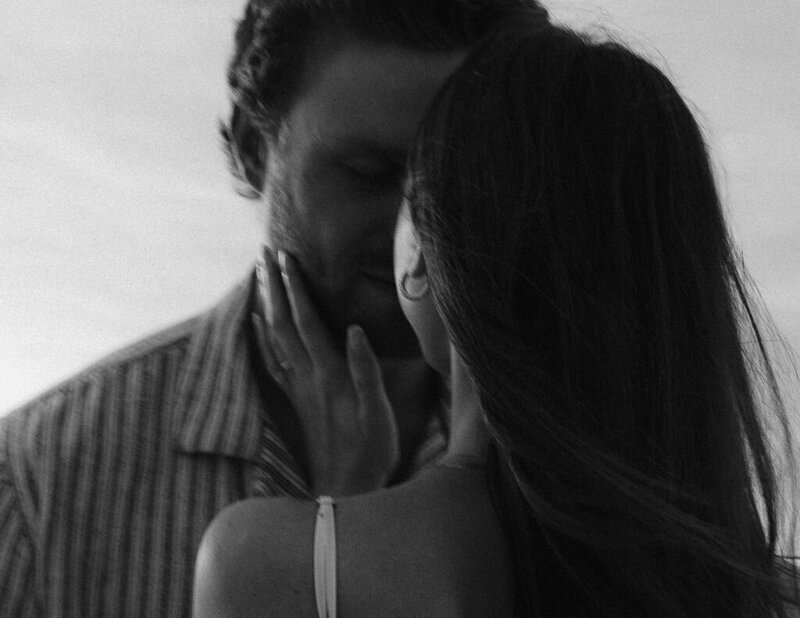 couple touching foreheads taken by engagement photographer naples fl