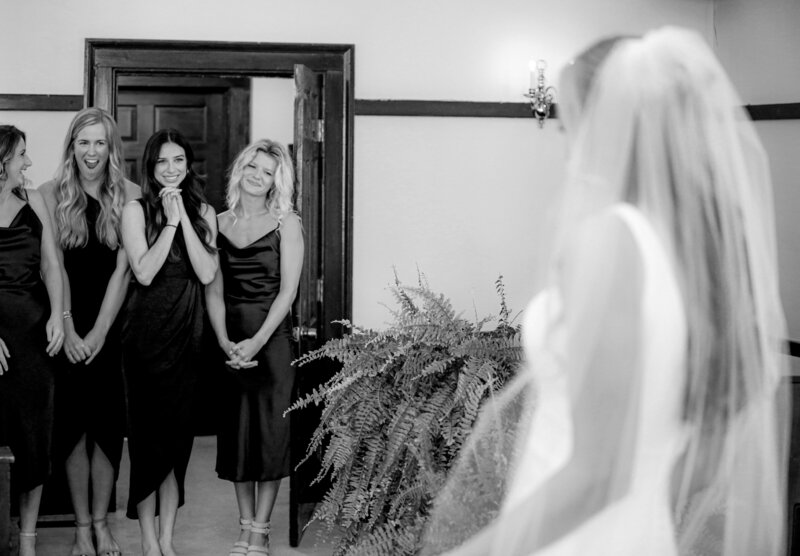 Light Shifter Studios:  A North Carolina bride has a first look with her bridal party on her Wedding Day. 