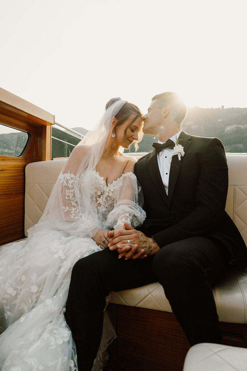 Couple kissing at their beach wedding in Italy