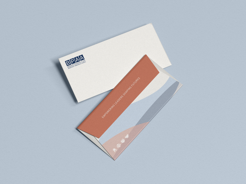 Soft and colorful brand identity design shown on business envelope on pale blue background, designed by woman-owned branding agency in Knoxville