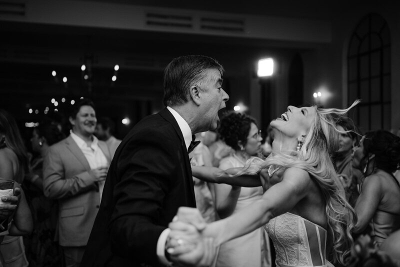 A bride and groom cutting their wedding cake. Photographed by Casey McMurray