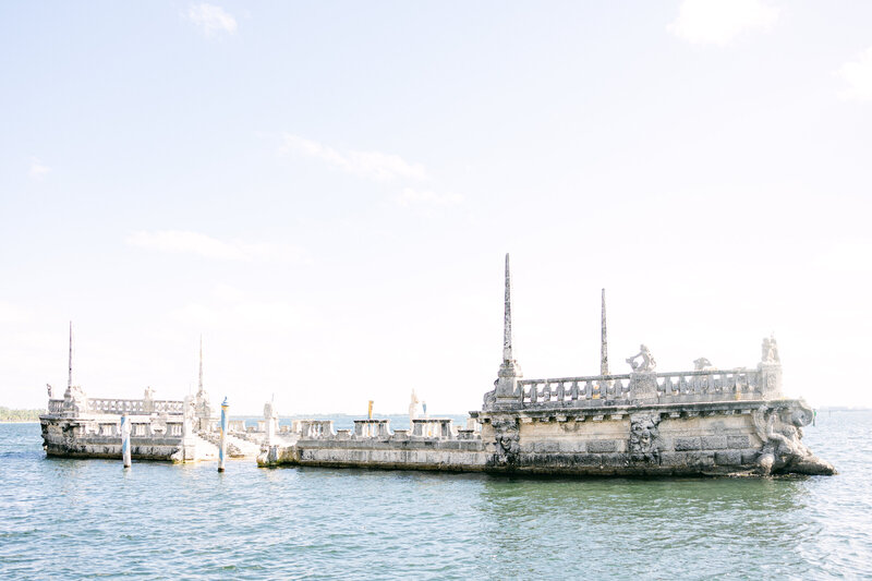 The historic stone barge at Vizcaya Museum & Gardens in Miami, Florida, a breathtaking waterfront venue for elegant and timeless weddings. This iconic location offers a romantic backdrop for luxury wedding Amia Marcell Wedding Photographer