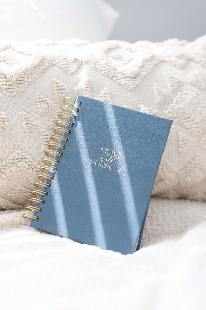 blue move with purpose fitness journal with gold coil binding