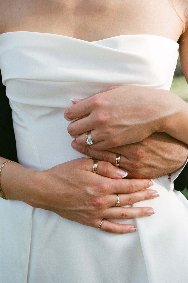 Intimate wedding detail photo in Austin, Texas with clean white gown and natural film tones