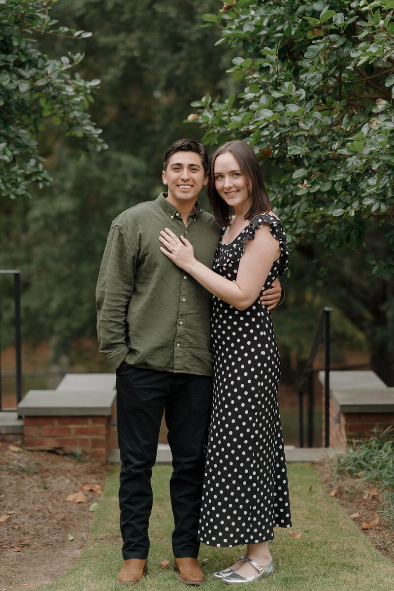 Couple posing after proposal in Marietta.