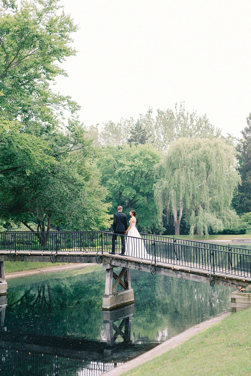 Married Couple holding hands walking in the garden