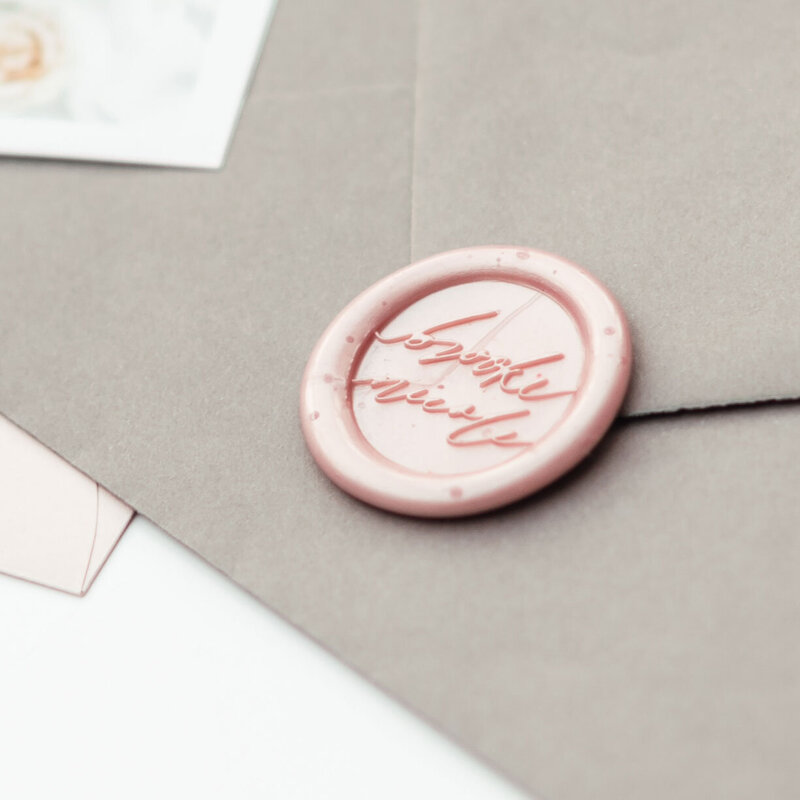 Pink wax seal with signature for luxury brand design project