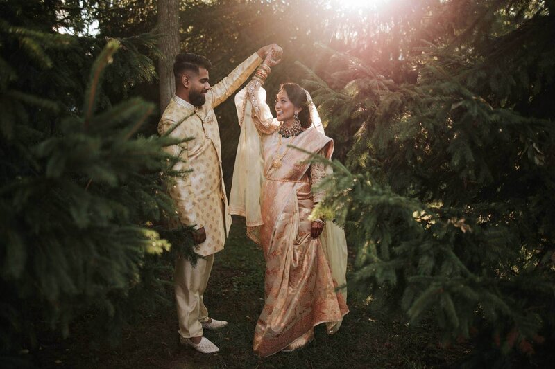 South Asian couple hug and enjoy solitude after ceremony in the canopy of the trees at Royal Alberts Palace