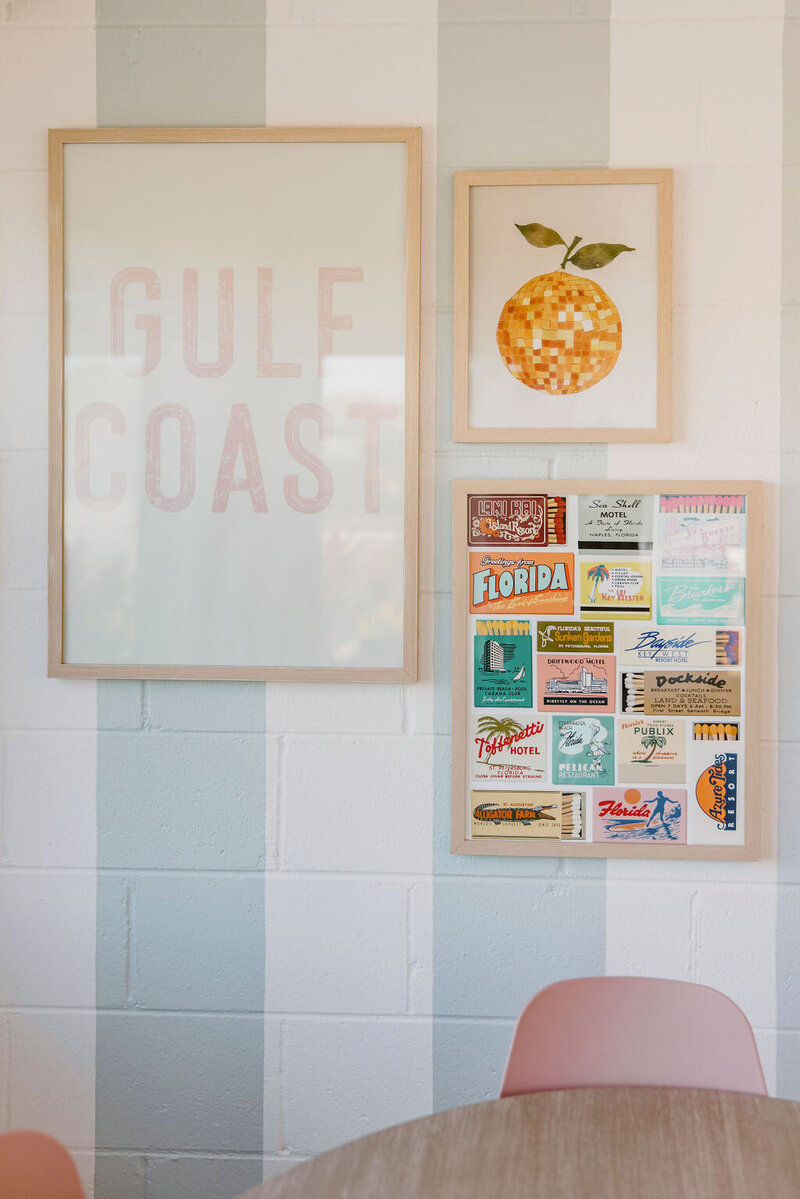 Gulf coast framed art, orange framed art, on blue and white striped wall