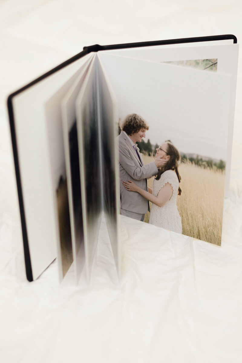 wedding album on display taken by Spokane engagement photographer