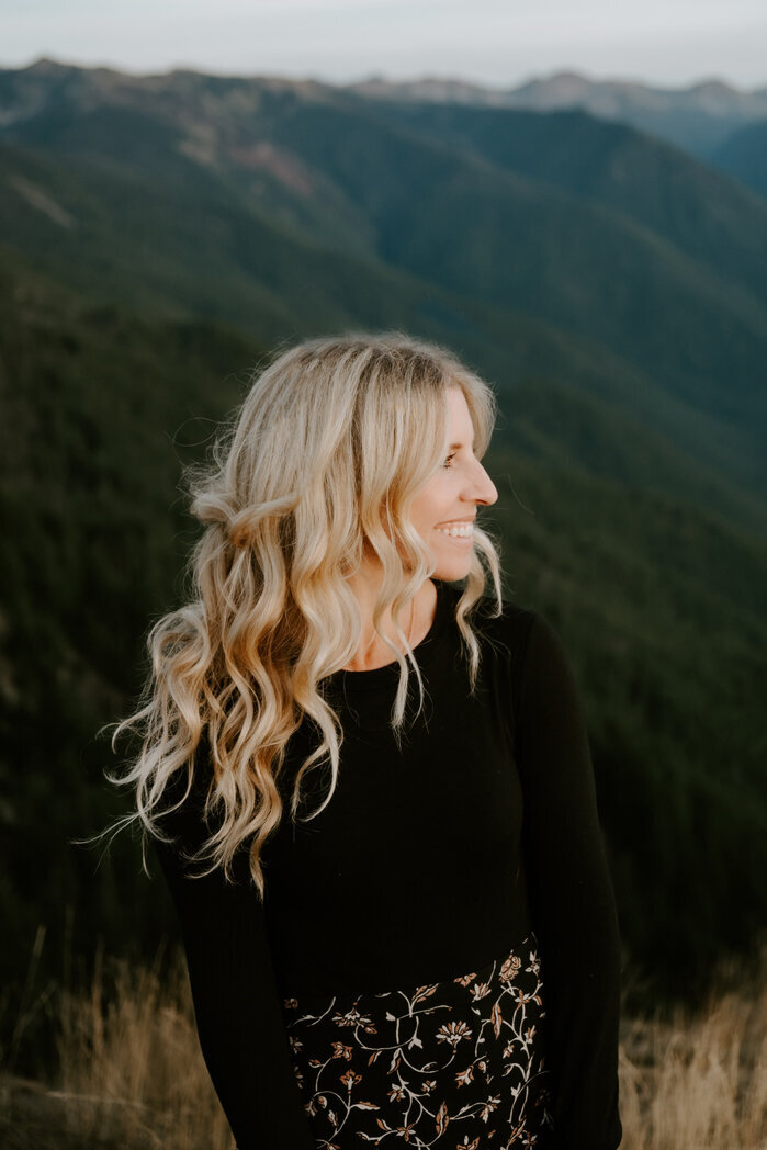 Washington elopement photographer Amy Galbraith walks through a sage field in Grand Teton National Park