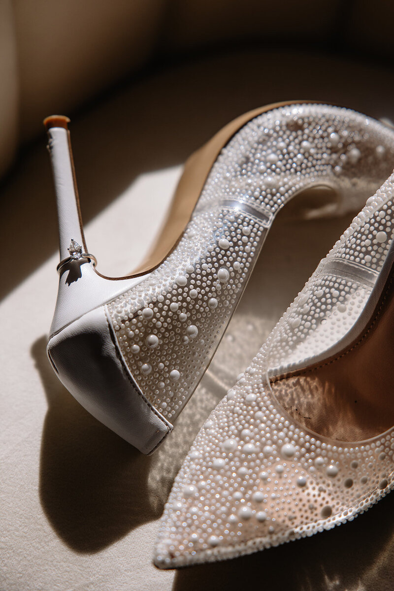 Unique wedding ring detail with pearl heels. Editorial style photo with natural, timeliness editing. 