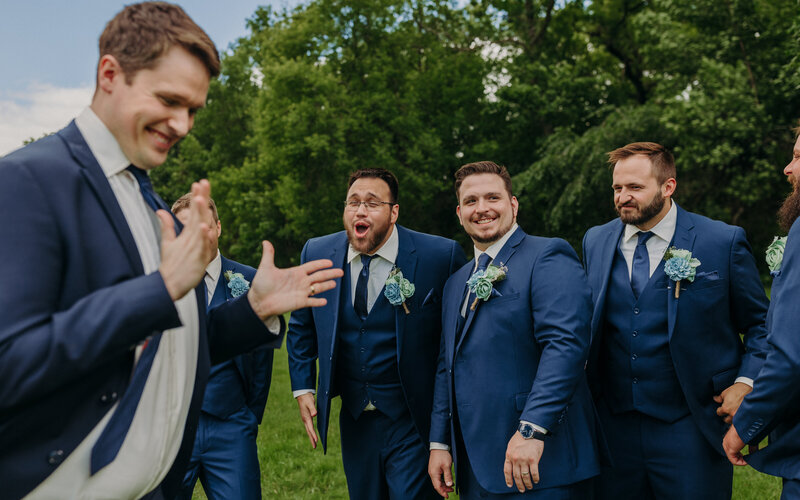 Groomsmen laughing and dancing