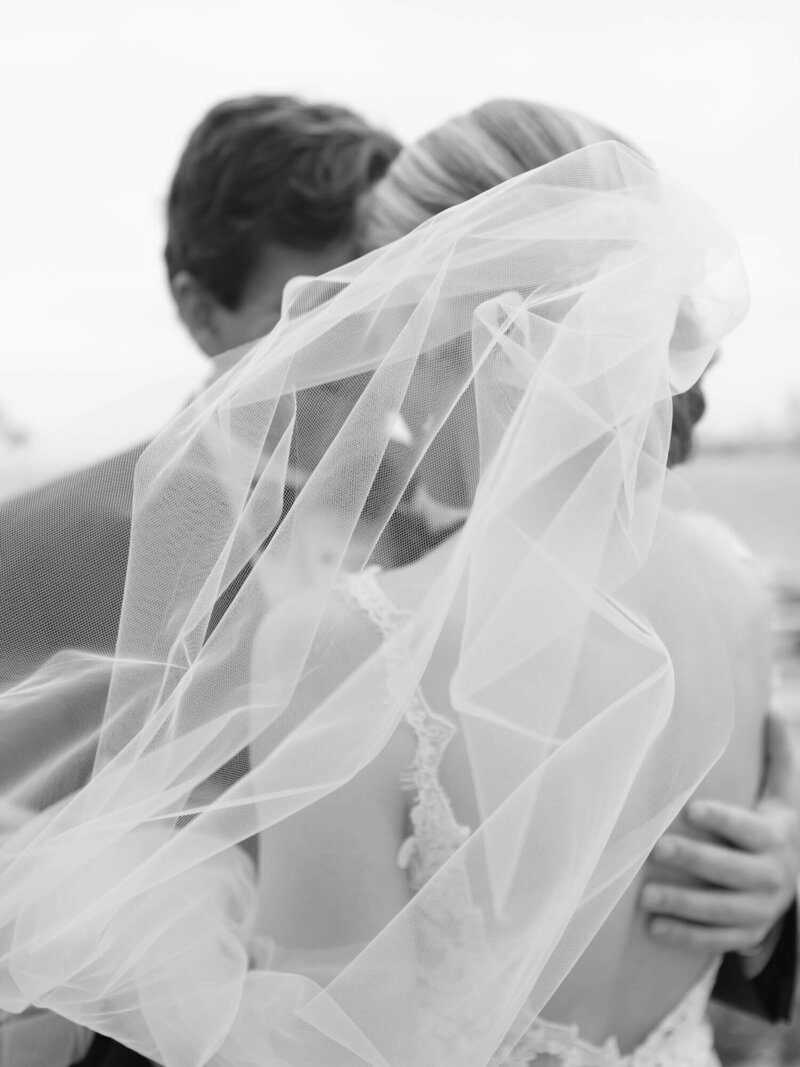 black and white veil photo of bride and groom in long beach
