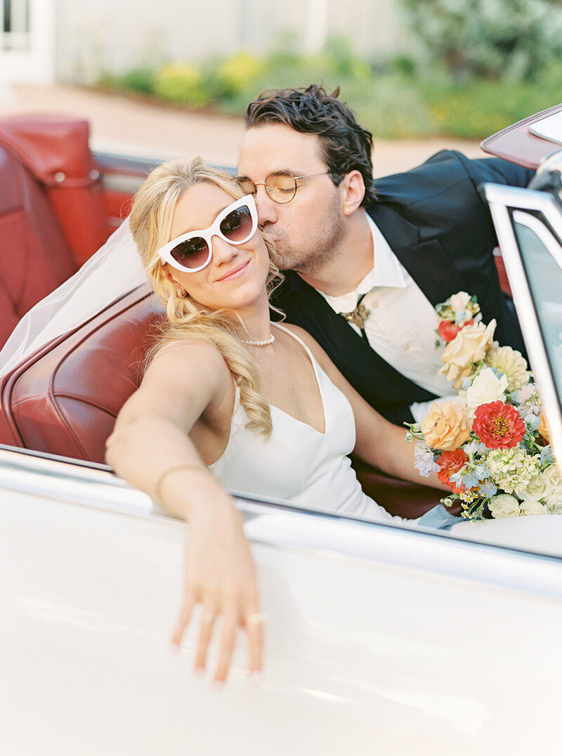Wedding party cheers during reception at the wayback in texas