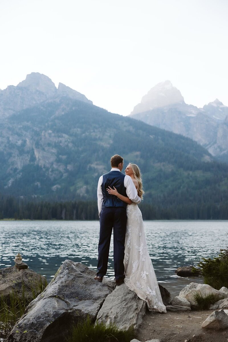 A couple on the shore of Sawtooth Lake in Idaho after their elopement