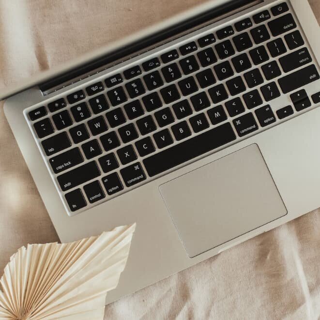 Laptop on desk representing frustration with a website that is live but not engaging visitors