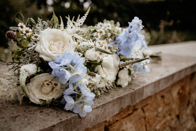 Close up of brides white and blue wedding  bouquet
